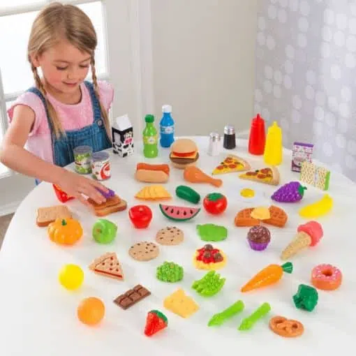 KidKraft's 65 piece pretend food play set enables children to enjoy and explore the world of food and would be the perfect accessory for any Play Shop or Kitchen.
