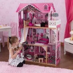 Kidkraft Amelia Dollhouse is an elaborately decorated wooden dolls house with detailed internal furnishings including 14 play pieces