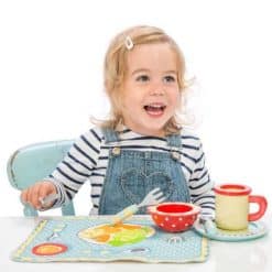 This beautiful Wooden Honeybake Dinner Set by Le Toy Van, features an illustrated fabric mat enables children to position toy cutlery and crockery, helping them to learn about positioning and the language of place setting.