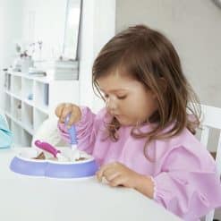 The Babybjorn Eat and Play Smock offers soft yet durable protection against spots and spills. It’s helpful at mealtime and when your child is painting