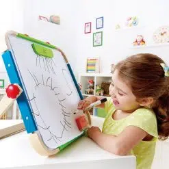 Hape Anywhere Art Studio is a tabletop easy to fold art easel that will keep your little artists busy with a magnetic whiteboard, chalk board, and magnetic shape.