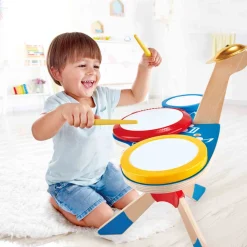 Hape Toys Drum and Cymbal Set will get your little musician drumming with this triple drum kit. Just the right height for children, it includes two easy-grip drum sticks.