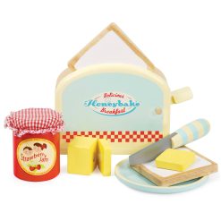 Le Toy Van Toaster Set, with a spring-loaded toaster, two slices of toast, a butter pat with velcro, a pot of jam, a knife and a plate, has all a little one needs to give Mummy and Daddy breakfast in bed.