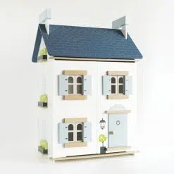 Le Toy Van Sky Dollhouse is a very charming, traditionally styled wooden dolls house,  with an added modern luxe feel.