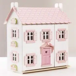 Le Toy Van Sophie's Dolls House is a beautiful white wooden dolls house laid out over 3 levels with a pink sparkling roof and windows.