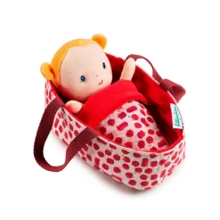The lovely Lilliputiens Baby Doll Agathe lies snuggly in her reversible basket underneath her blanket. When she wakes, it is time to change her nappy.