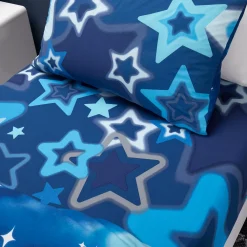 This Ombre Stars Blue Single Fitted Sheet by Catherine Lansfield features featuring a stunning cosmic ombré design in deep blue.