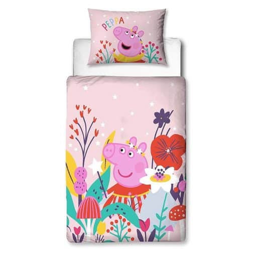 Peppa Pig Magic Reversible Toddler Duvet Set features Peppa in a pretty Fairy outfit surrounded by large colourful flowers, on a pale pink background patterned with small white Stars.