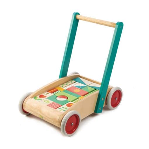 Tenderleaf Toys Baby Block Walker is a sturdy wooden baby walker with large rubber wheels, with the 29 colourful wooden blocks and shapes that can be matched to the stenciled shapes.