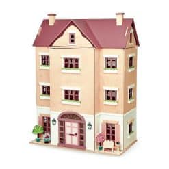 Tenderleaf Fantail Hall is a magnificent wooden dollhouse with a central gable on the front elevation, two patio areas on either side